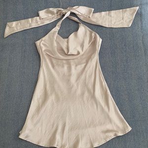 The model is shown in the dress in another color. Only worn once.